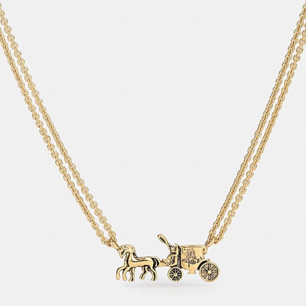 Coach horse carriage necklace.

Lobster clasp closure
Adjustable 16" - 18" (L)